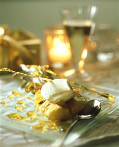 Baked pineapple with vanilla ice cream and caramel threads
