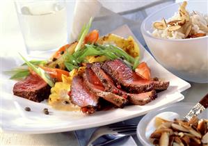 Fillet steak with exotic fruits and almond rice