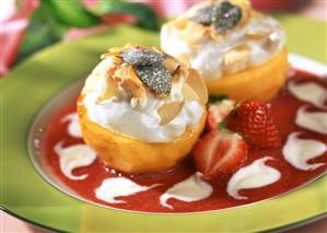 Baked peaches on strawberry sauce