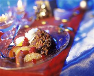 Christmas pudding with fruit and cream