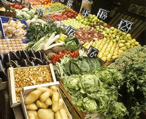 Market stall with fruit & vegetables crates in Austria