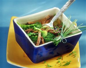 Boiled beef fillet soup with strips of savoy