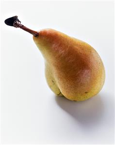 A yellow and red pear with stalk and small leaf (2)