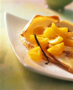 Apricot compote with thin crepes