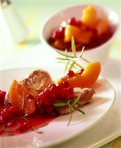 Pork medallions with peach and cranberry compote