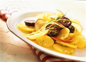 Swabian potato salad with black pudding and apple slices