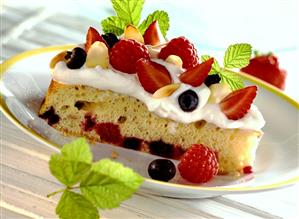 A piece of berry torte with vanilla cream