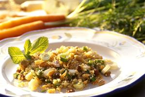 Tasty quinoa salad with fruit, raisins and mint