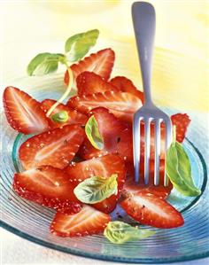 Strawberry carpaccio with black pepper and basil