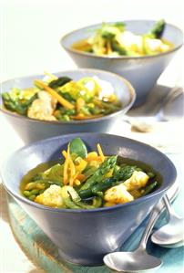 Fish soup with curry and vegetables