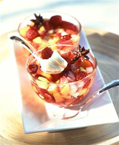 Fruit and berry salad and a spoonful of yoghurt