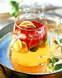 Strawberry and lime punch with lemon balm in a carafe