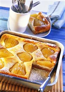 Pear quark cake, pieces cut on a baking tray (1)