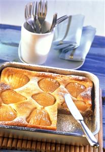 Pear quark cake, a piece cut on baking tray (2)