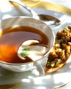 Pheasant consomme with yellow boletus slice & toast