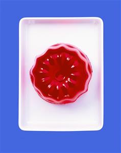 Turned-out raspberry jelly on rectangular dish