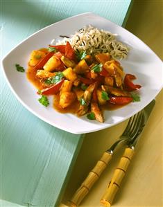 Strips of pork, sweet and sour sauce and rice