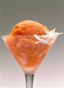 Papaya sorbet in ice bowl