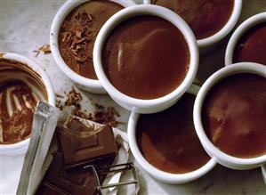 Chocolate flummery in china dishes with chocolate