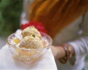 Apricot ice cream garnished with apricot wedges & Pan Masala (2