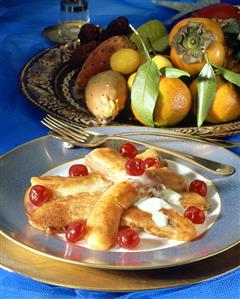 Baked bananas and fruit plate with exotic fruit