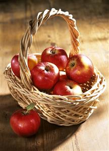 A small basket of red apples