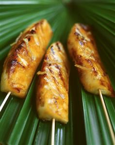 Grilled pineapple kebabs with honey and lemon zest