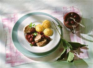 Pork medallions on cherry sauce with duchess potatoes