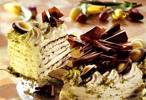 An Easter cake with chocolate curls and fondant eggs