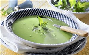 Green pea soup with mint leaves