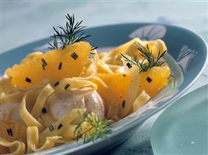 Scallops with tagliatelle on orange and fennel sauce