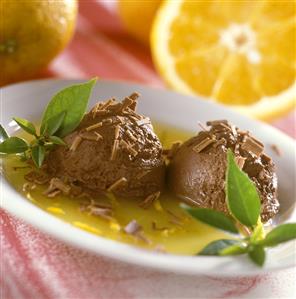 Chocolate ice cream with orange sauce