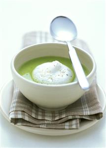 Creamed pea soup with cream topping