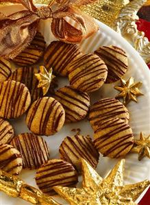 Gingernuts with chocolate icing on plate