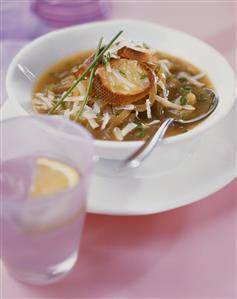 Onion soup with grated cheese and toasted bread