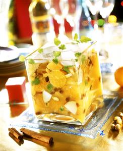 Orange and apple salad with ice cubes