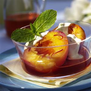 Peach compote with cream, saffron and mint leaf