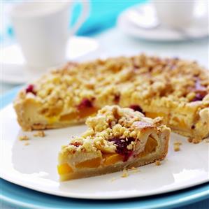 Peach crumble tart with raspberries