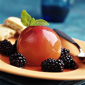 Poached peach with blackberries