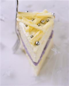 A piece of white chocolate and lavender cake