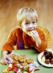 Small boy eating a chocolate biscuit (3)