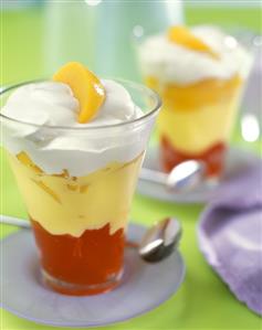 Layered peach and cherry dessert with cream