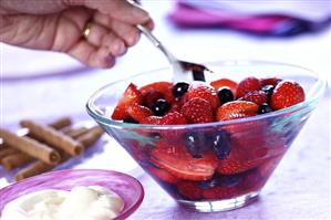 Berry salad and a bowl of cream