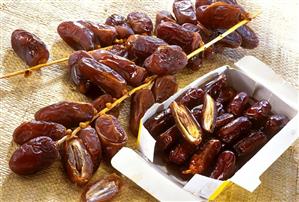 Dried dates on the stalk and in packaging