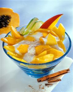 Mango and papaya salad with sour cream and cinnamon