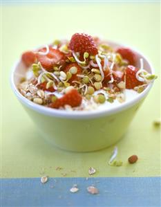 Muesli with yoghurt, sprouts and strawberries