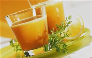 Multi-vitamin juice: bananas, oranges, lemons and carrots