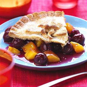 A piece of cherry and mango pie