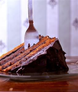 A piece of chocolate cake with fork