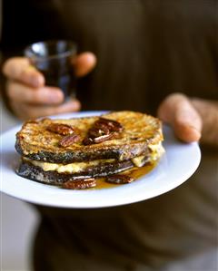 French toast-style bread with bananas, nuts, maple syrup